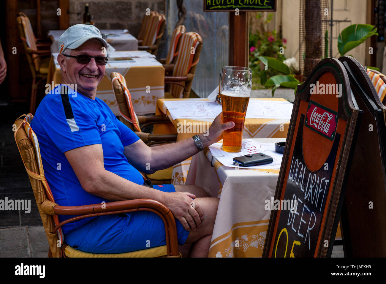 A Tourist Drinking A Large Glass Of Beer, Rhodes Old Town, Rhodes ...