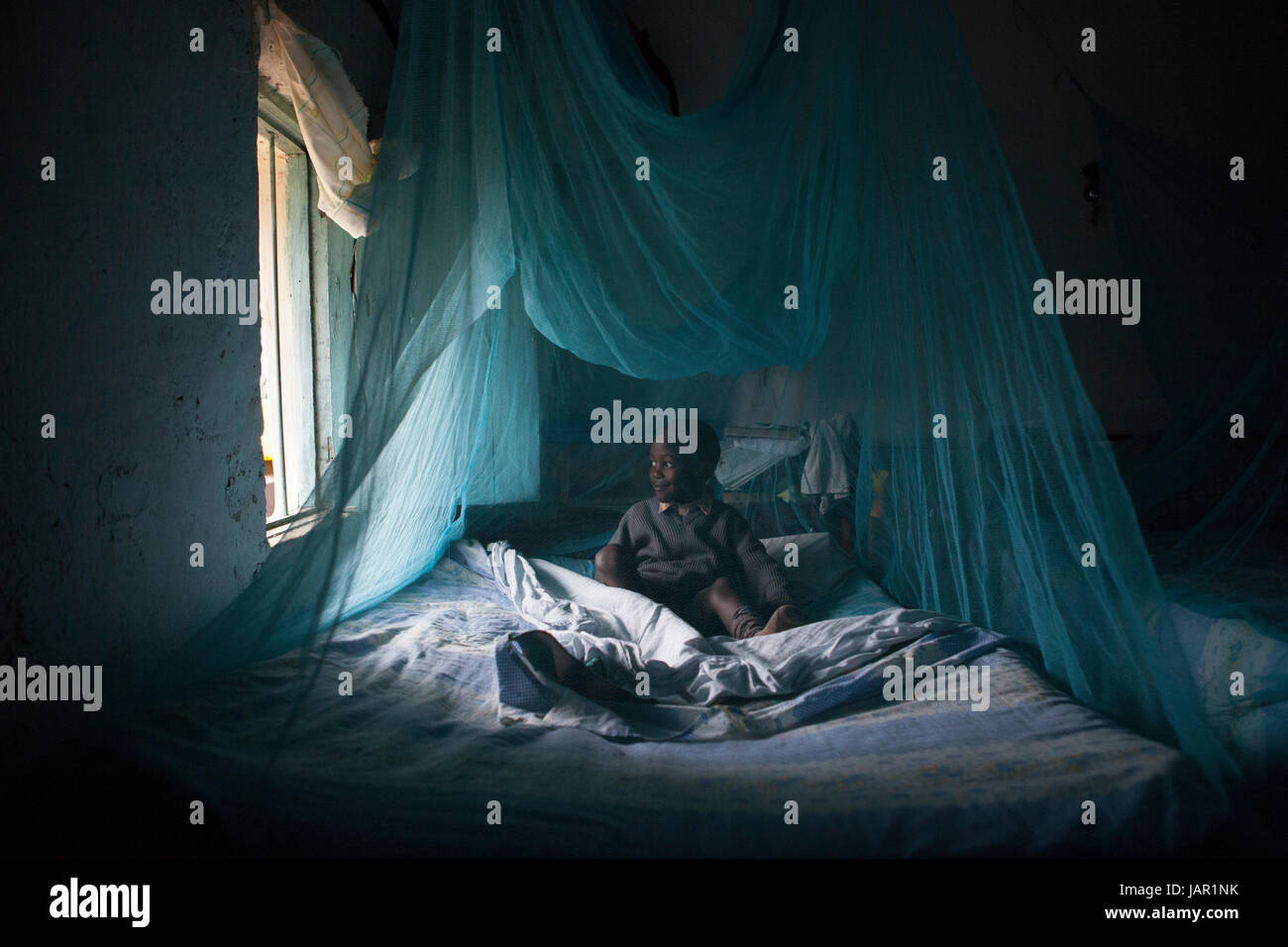 A child underneath a mosquito net, Kenya, Africa Stock Photo Alamy