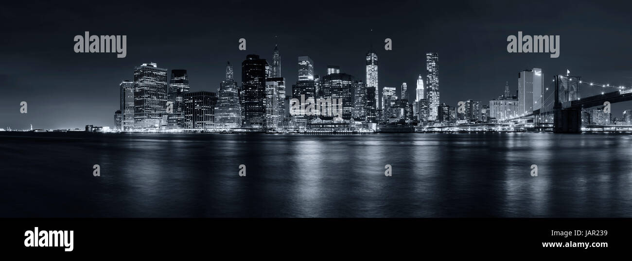 new york city skyline at night as a panoramic photo Stock Photo - Alamy