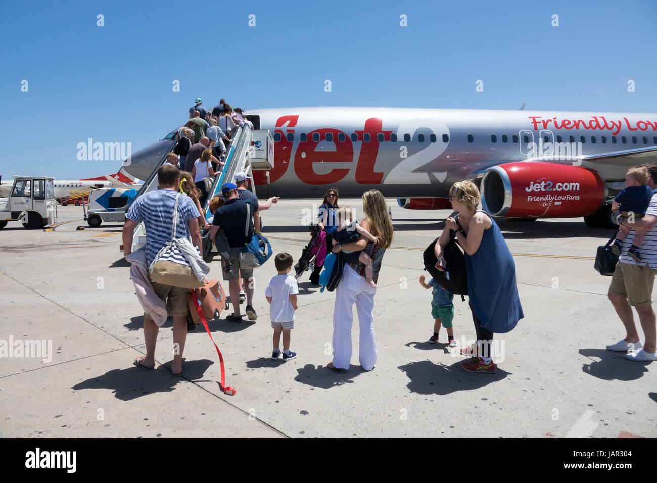 passengers-boarding-a-jet2-aircraft-at-ibiza-airport-stock-photo