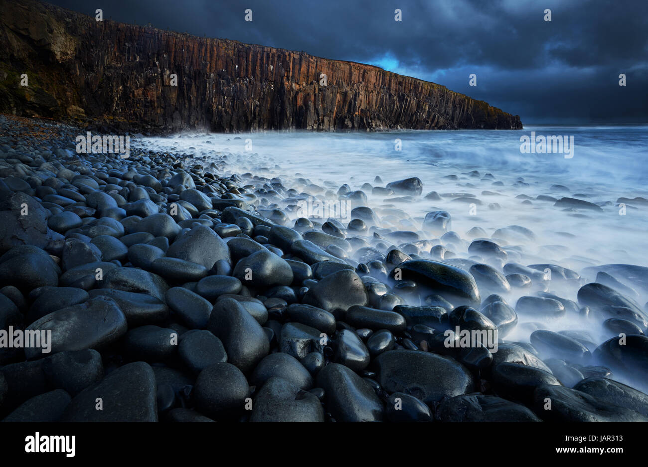 These spectacular Whin Sill cliffs lie to the south of Crastor on the Nothumberland coast. Stock Photo