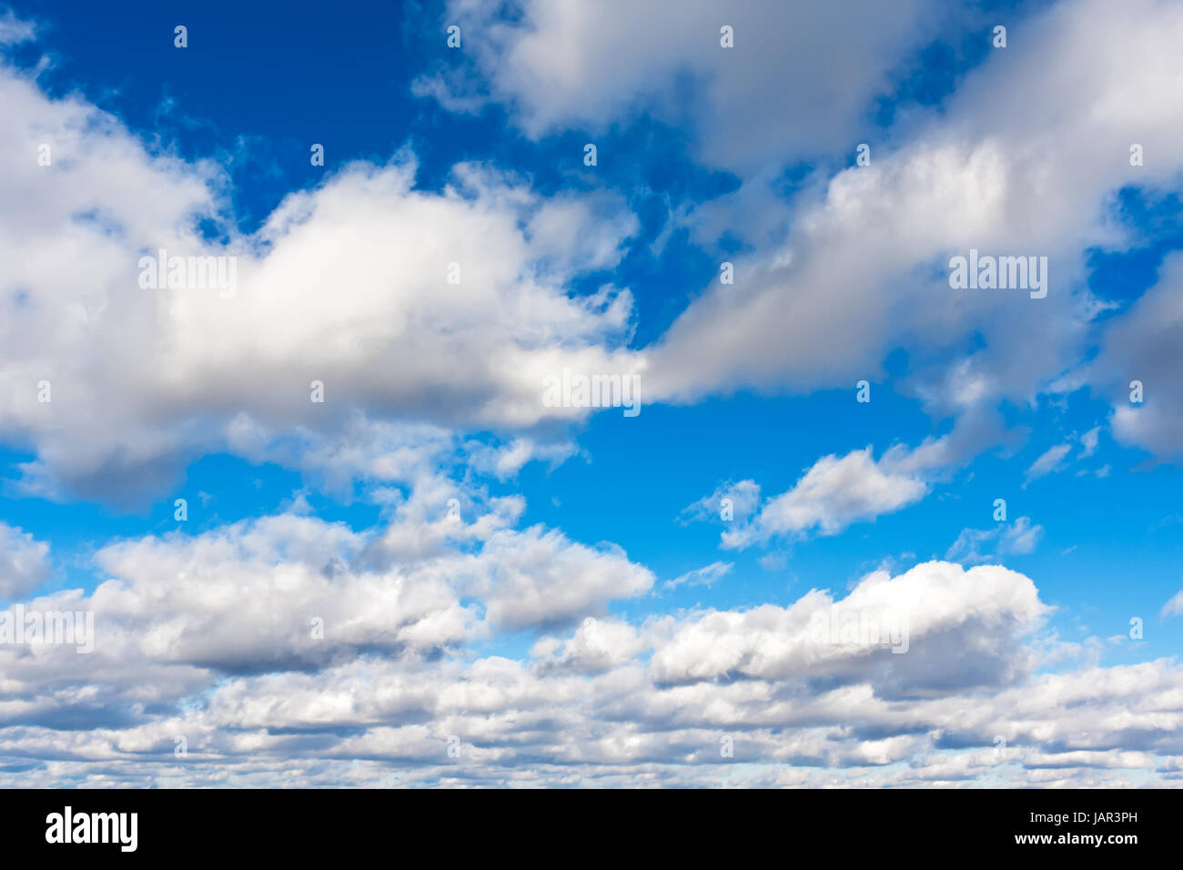 White clouds in blue summer sky background Stock Photo - Alamy