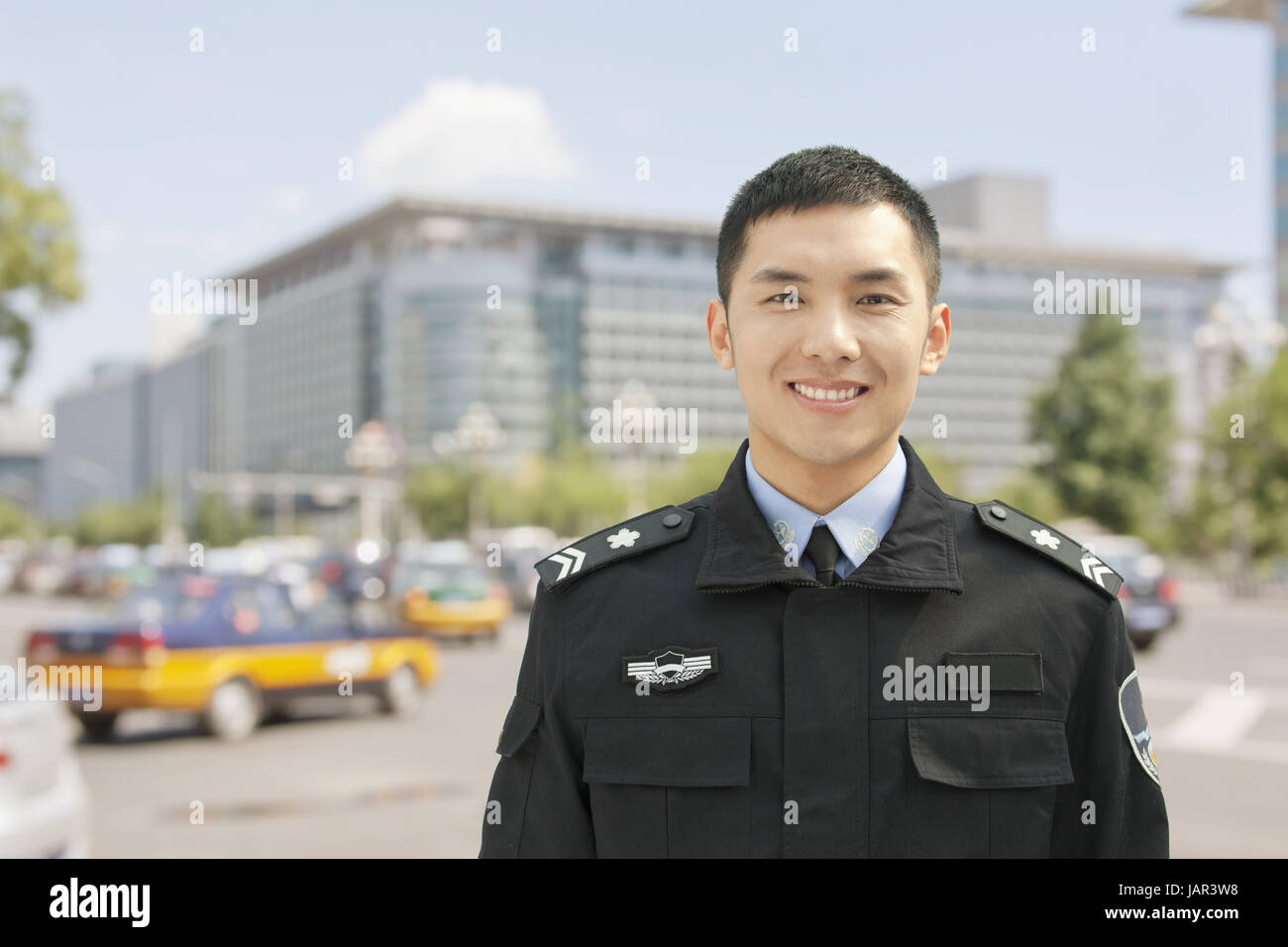 Police officer smiles camera hi-res stock photography and images - Alamy