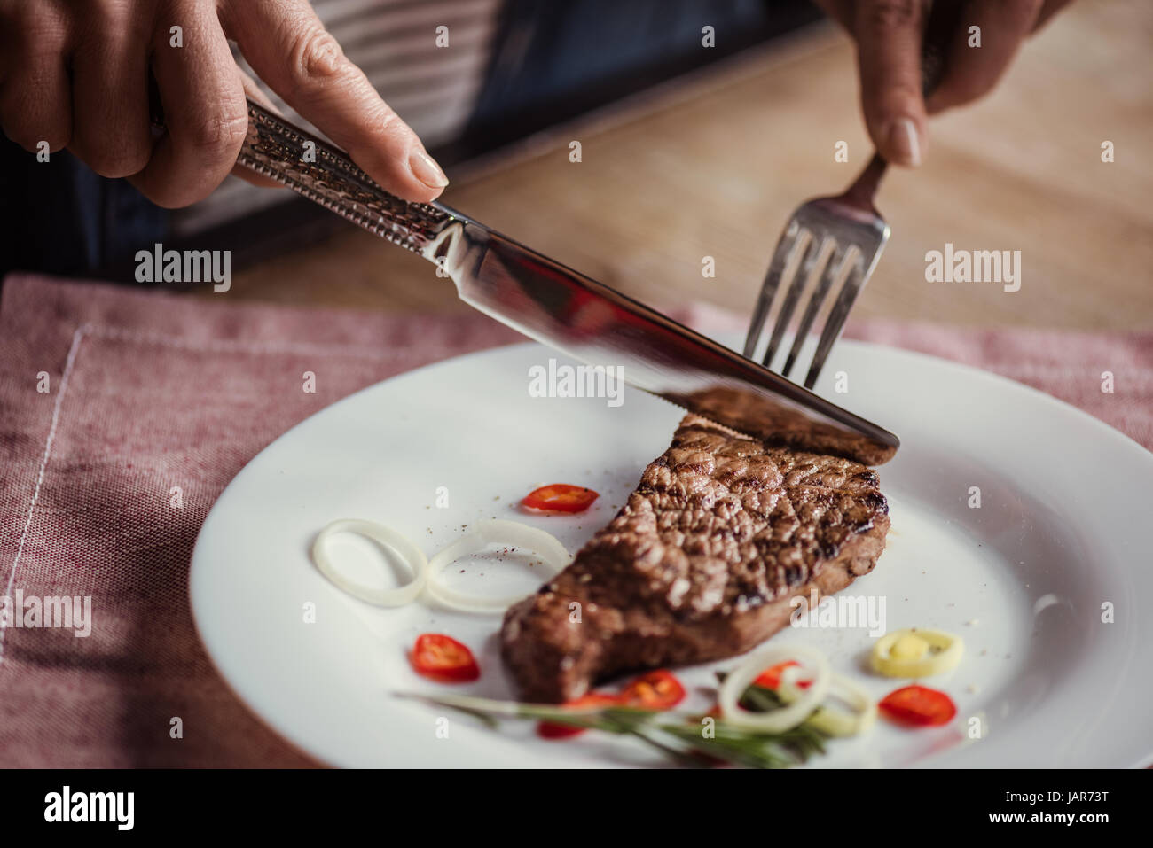 https://c8.alamy.com/comp/JAR73T/woman-eating-steak-JAR73T.jpg