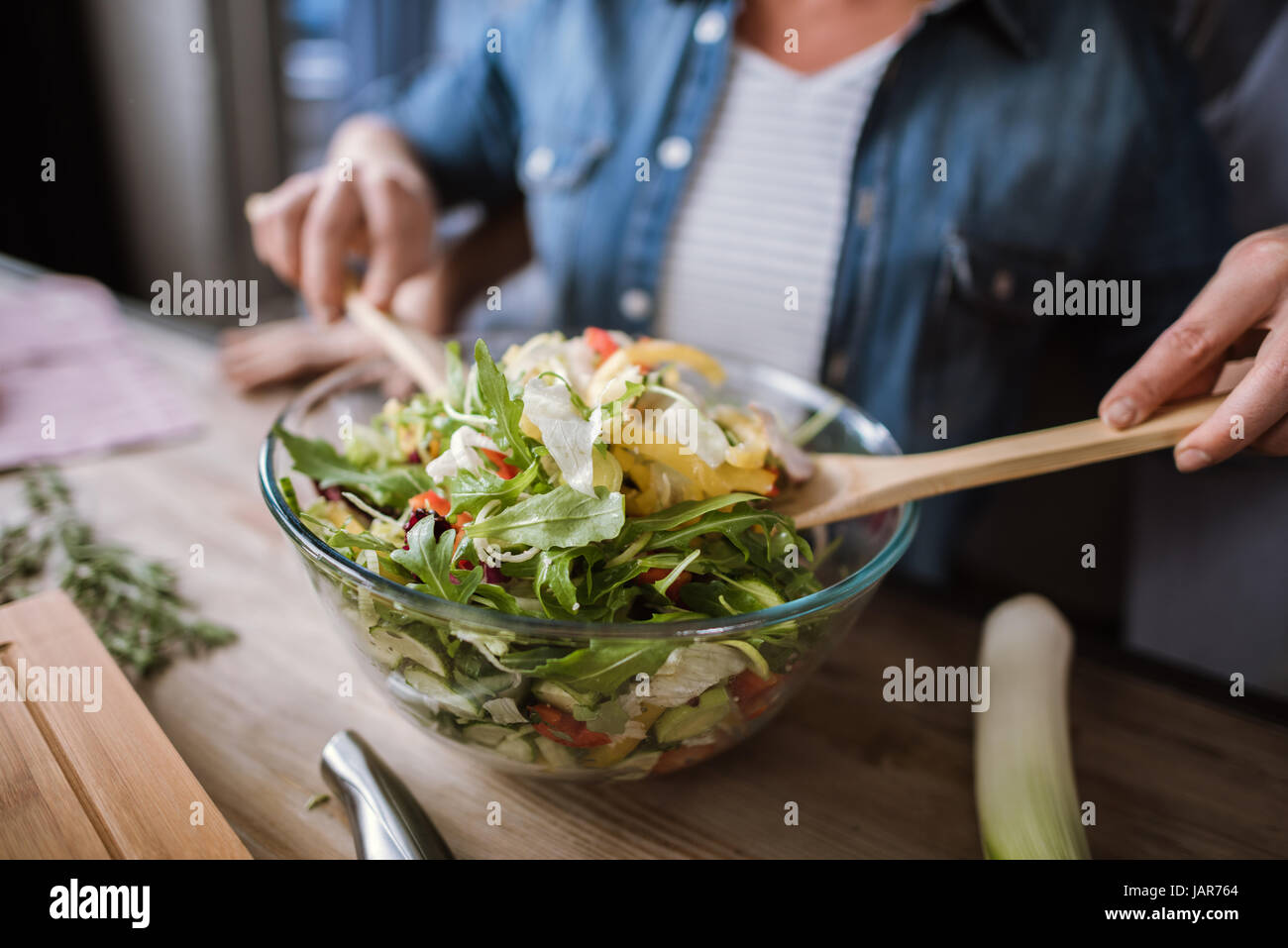 Couple cooking vegetable salad  Stock Photo