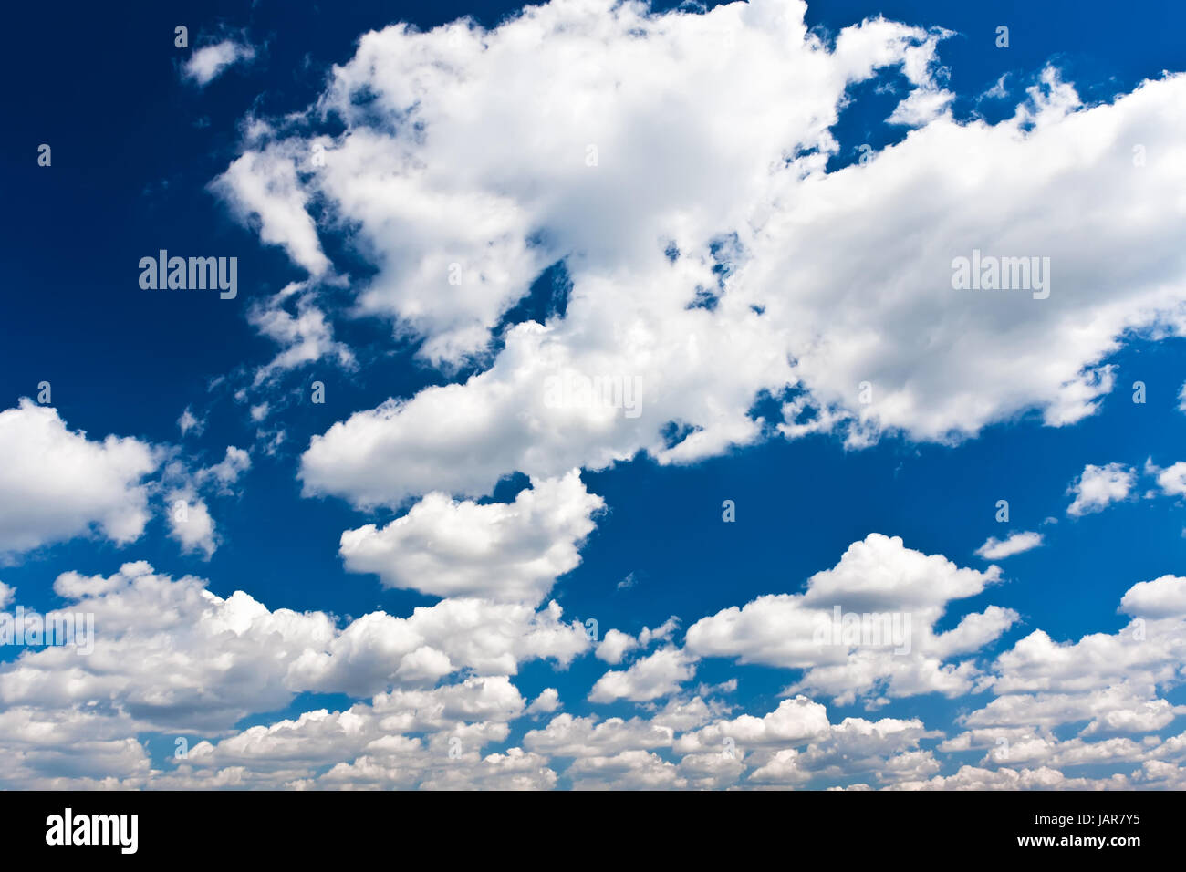 White clouds in blue summer sky background Stock Photo - Alamy