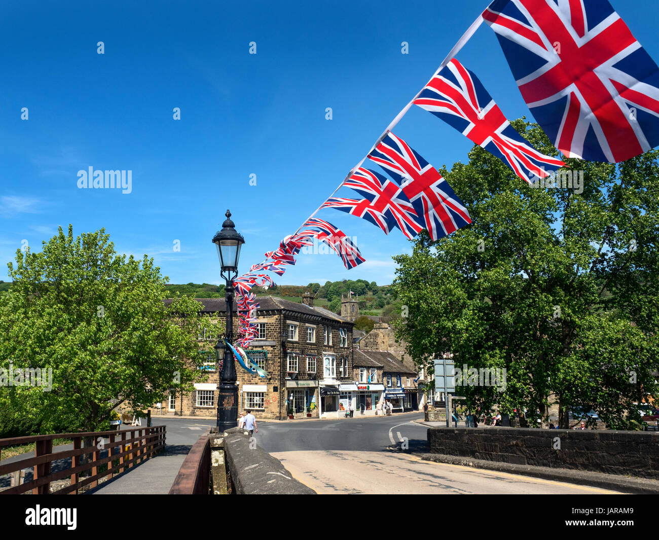 Union Jack Bunting on the Bridge over the River Nidd at Pateley Bridge North Yorkshire England Stock Photo