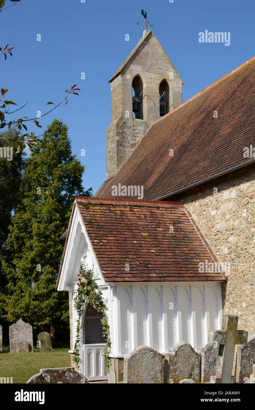 Saint Mary's Church at Chidham near Chichester. West Sussex. England. Showing porch and bell tower Stock Photo