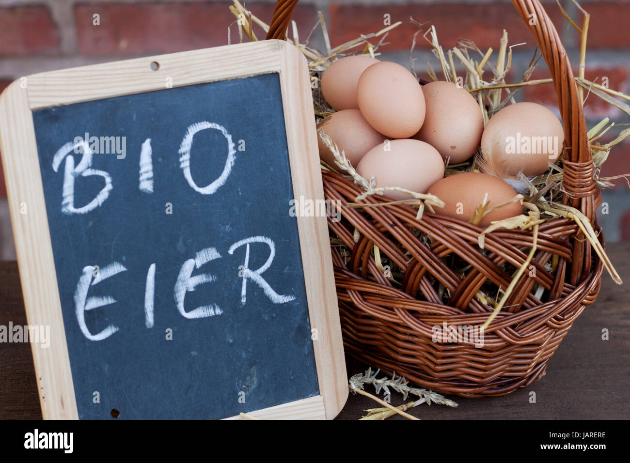 organic eggs in wicker basket Stock Photo