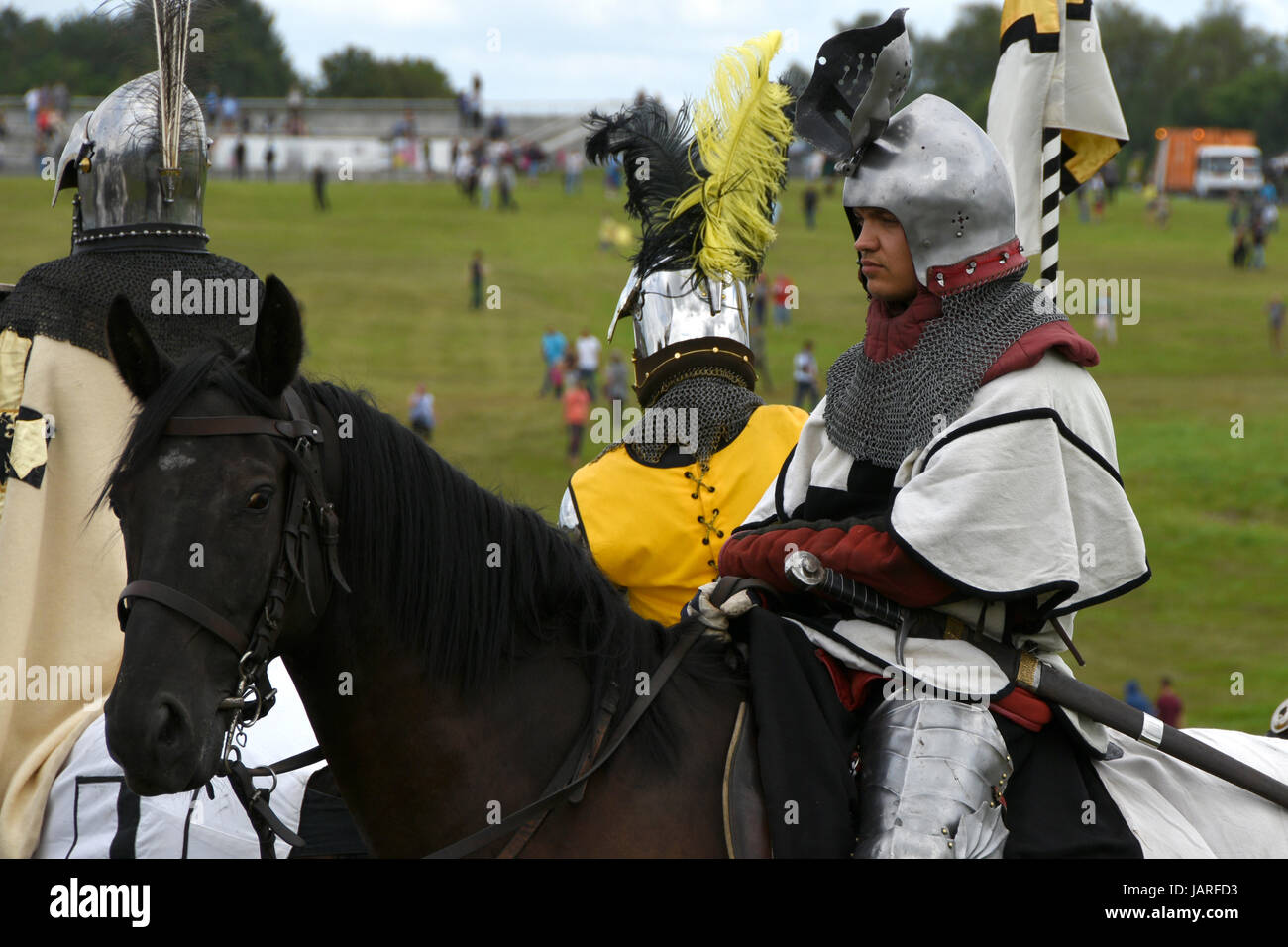 Battle of Grunwald. Clash of Teutonic knights, Polish and Lithuanian knights - Teutonic knight on a horse in a helmet with raised visor. Stock Photo