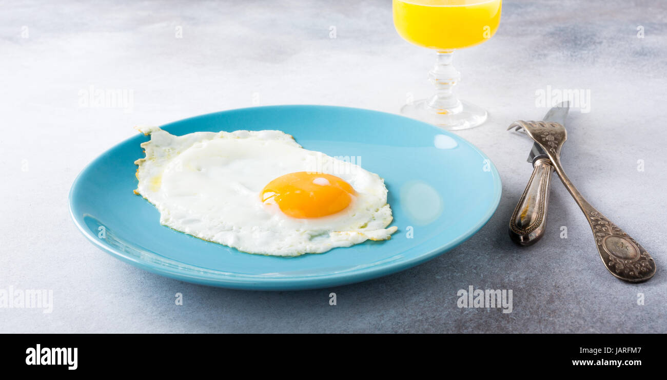 Fried egg and orange juice Stock Photo Alamy