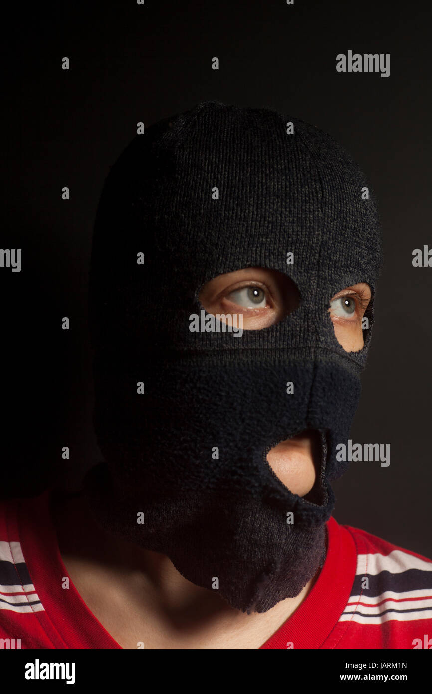 woman wearing in balaclava on black background Stock Photo Alamy