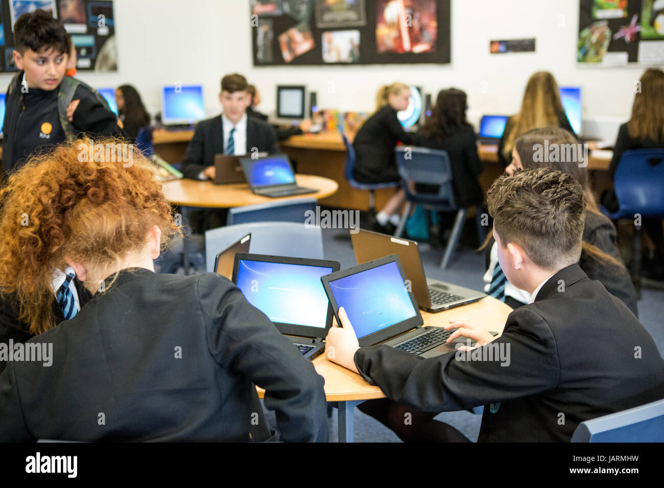 secondary school pupils using technology for learning Stock Photo