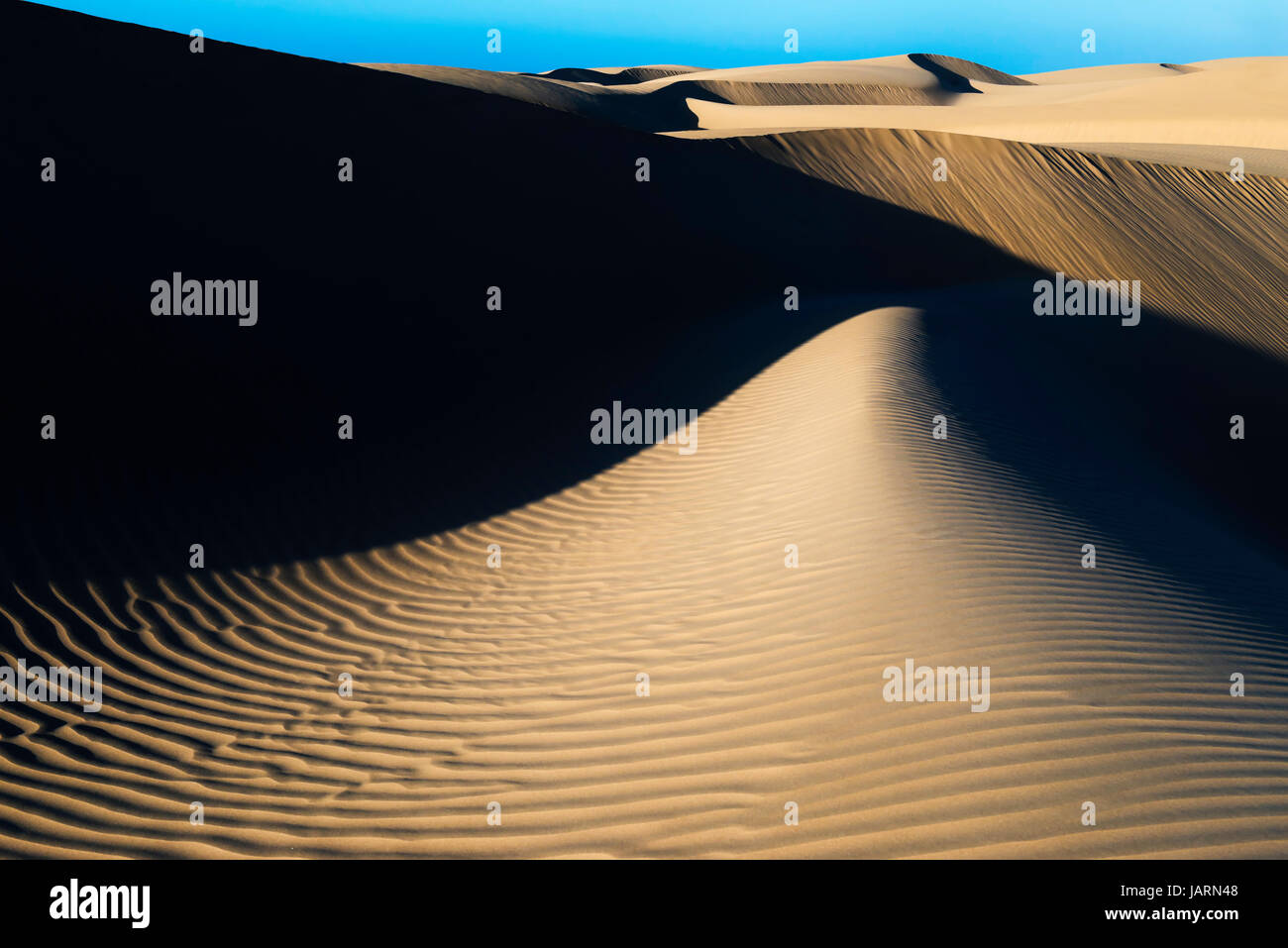 Sand dunes at the Lagoon of Khenifiss (Lac Naila), Atlantic coast, Morocco. Stock Photo