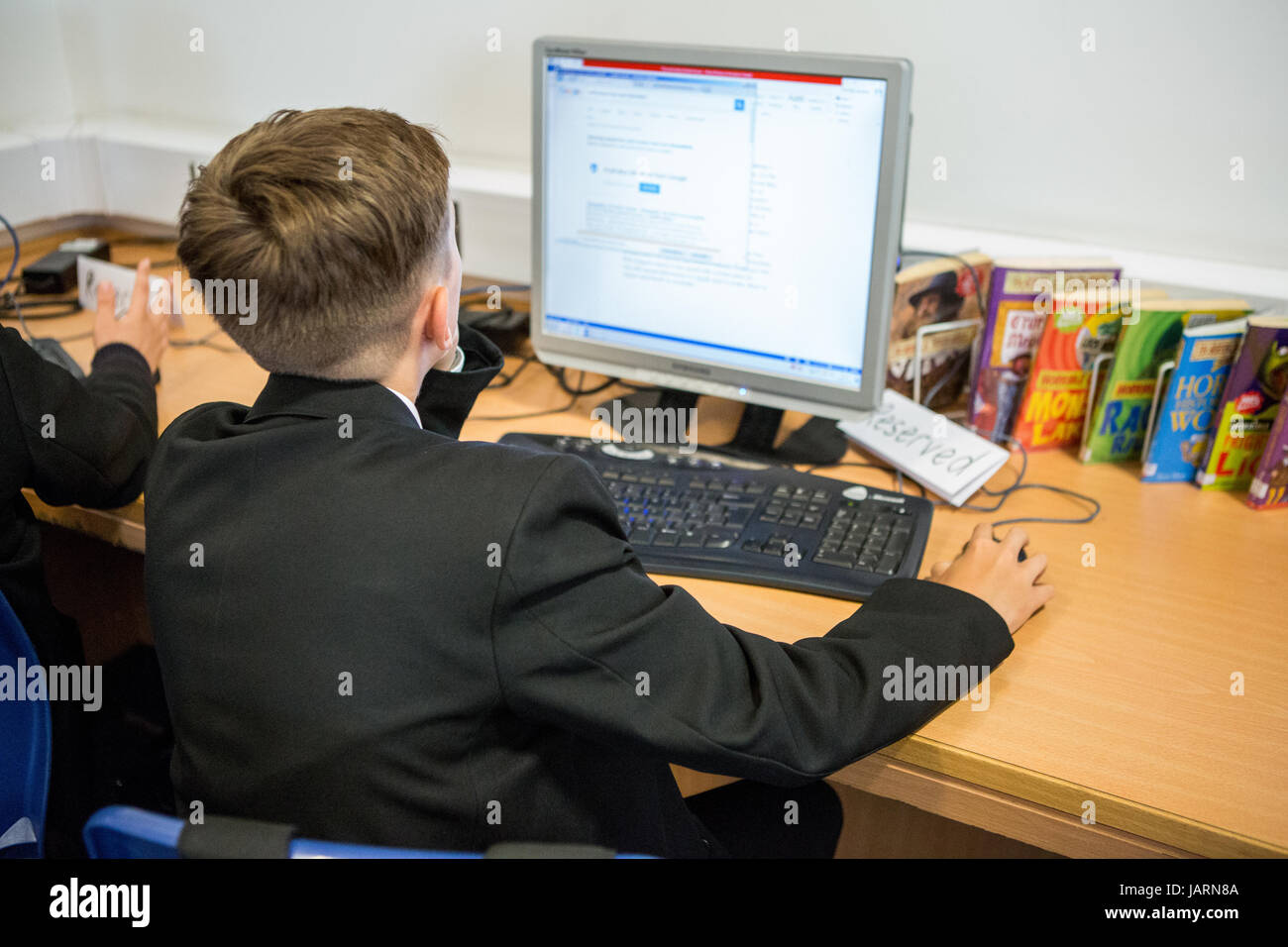 secondary school pupils using technology for learning Stock Photo