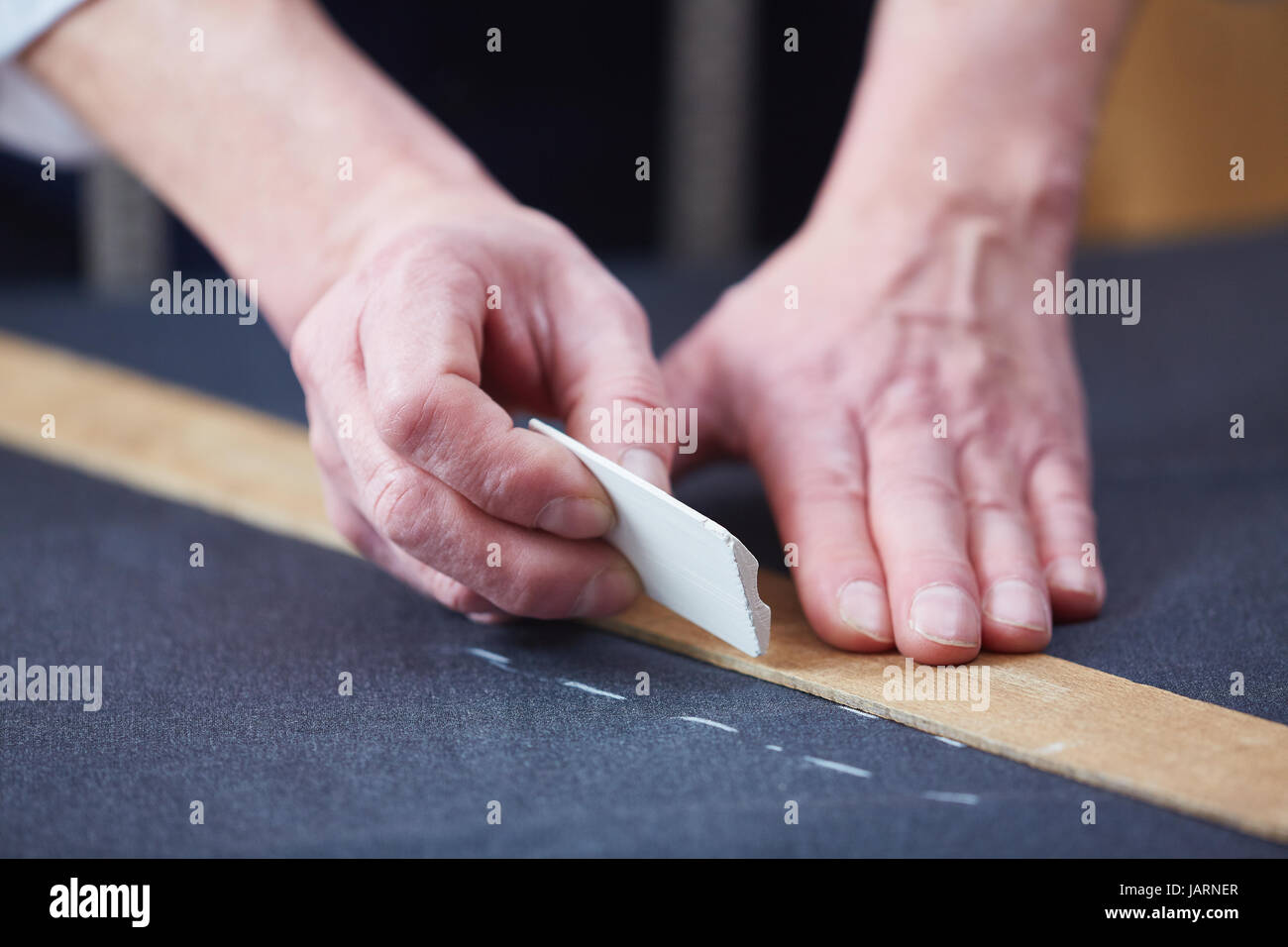 Tailors Hands Marking Fabric Stock Photo