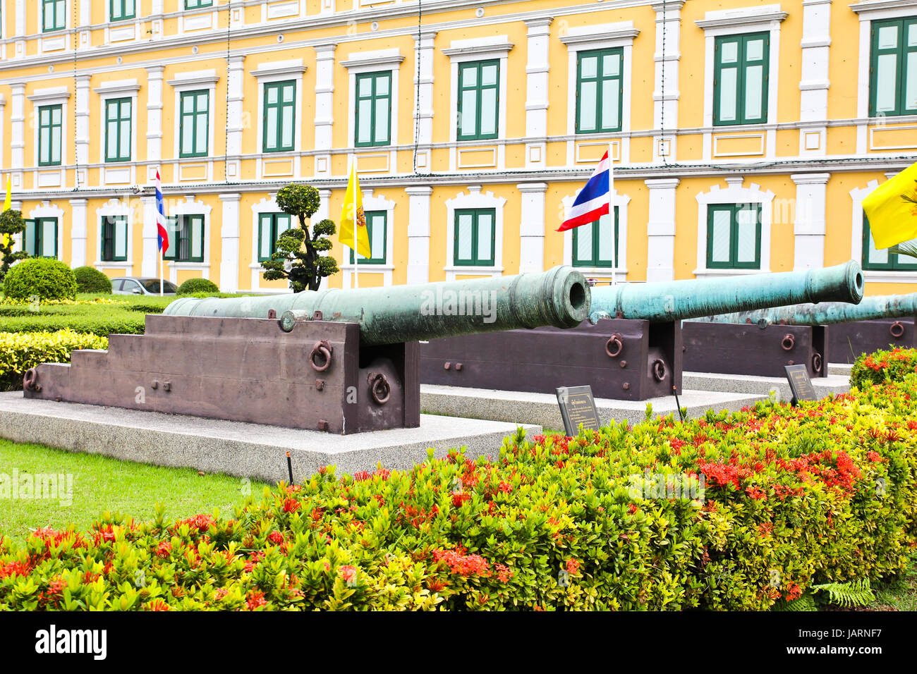 Ancient biggest cannon and Lion statue from Thai government museum, every body can take a photo and see. Stock Photo