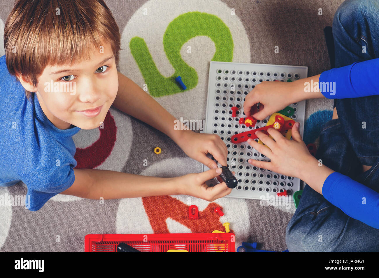 Children playing with toys tool kit.Top view Stock Photo