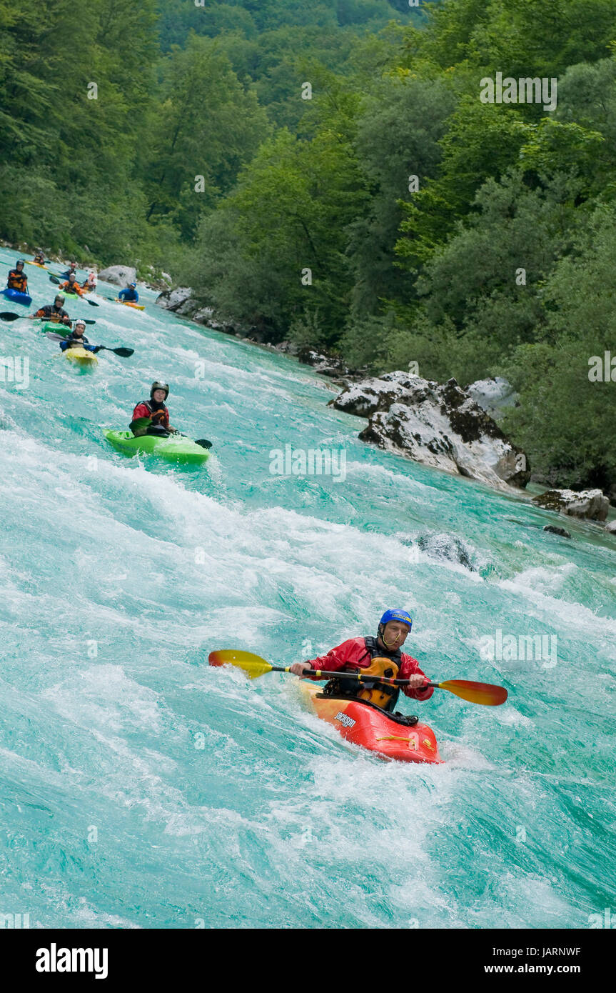 Line of kayakers on Soca river in Slovenia Stock Photo