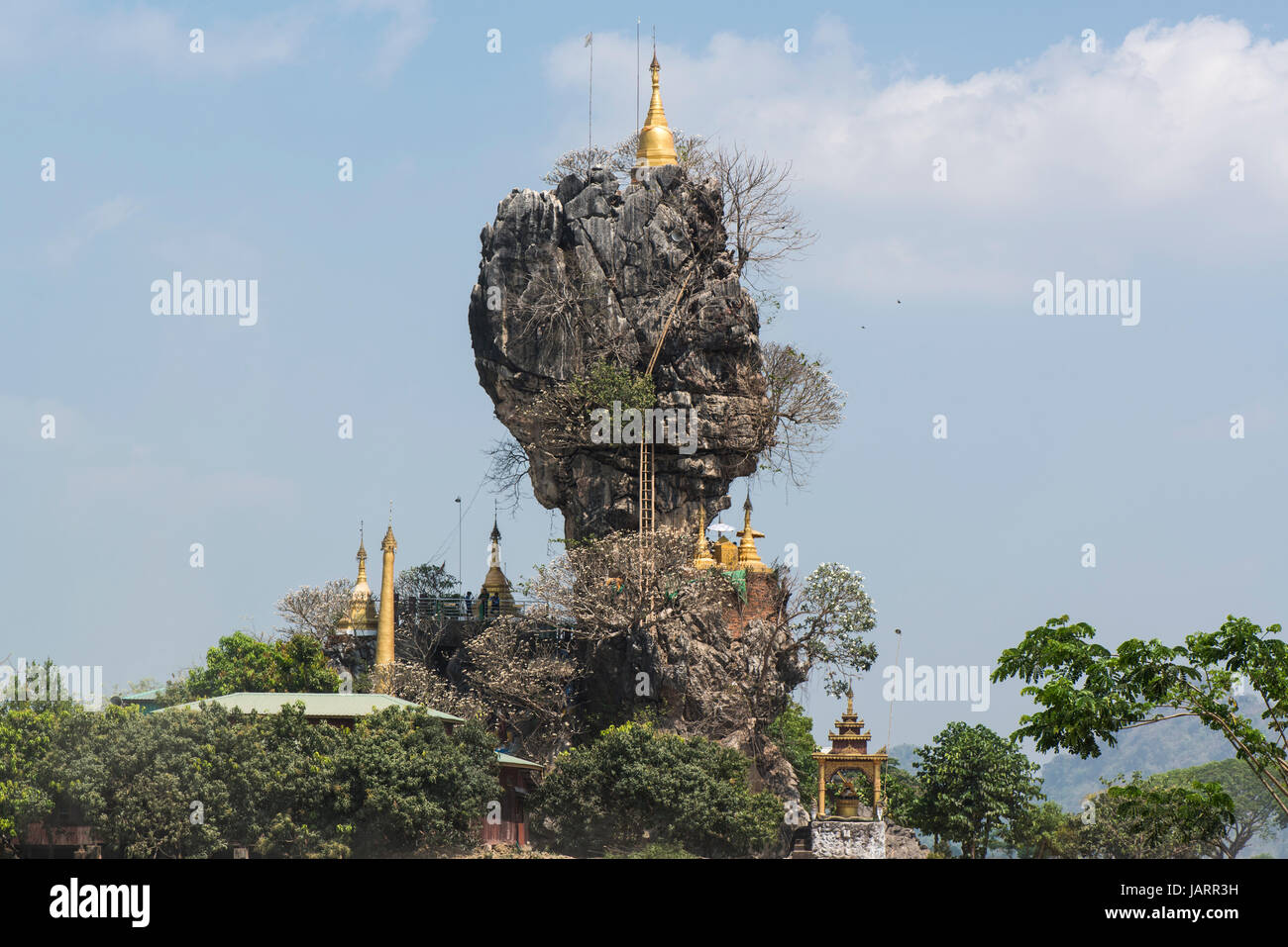 Buddhist Pagodas sit atop a limestone karst at the Kyauk Kalap Temple, Hpa-an, Myanmar (Burma) Stock Photo