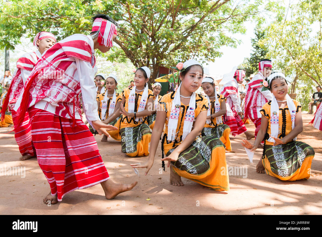 Children perform a traditional folk dance at the Kyauk Kalap Temple, Hpa-an, Myanmar (Burma) Stock Photo