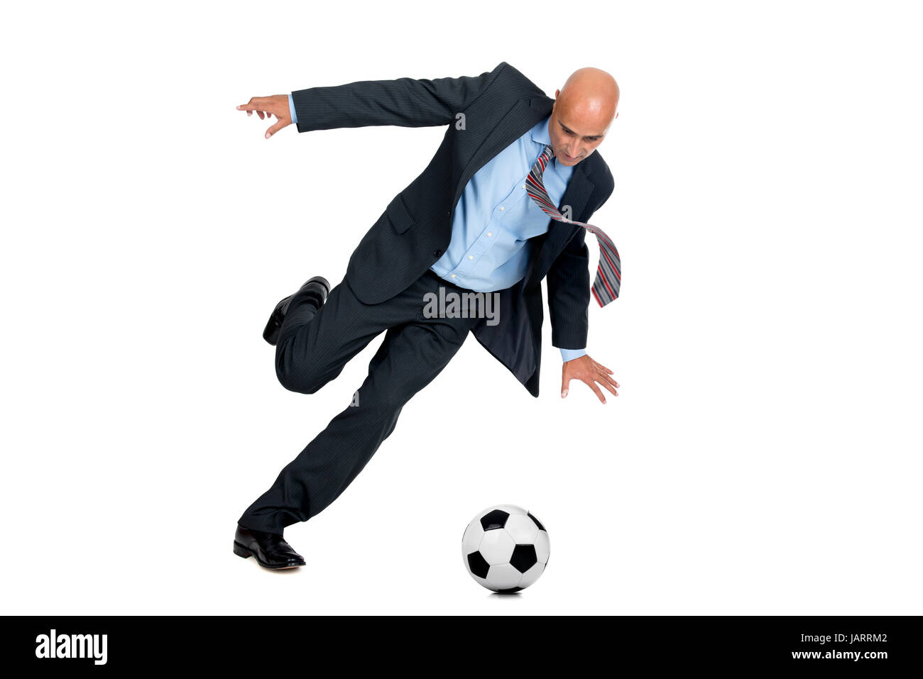 Businessman playing soccer ball isolated in white Stock Photo - Alamy