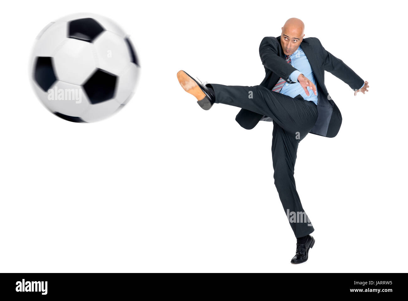 Businessman playing soccer ball isolated in white Stock Photo - Alamy