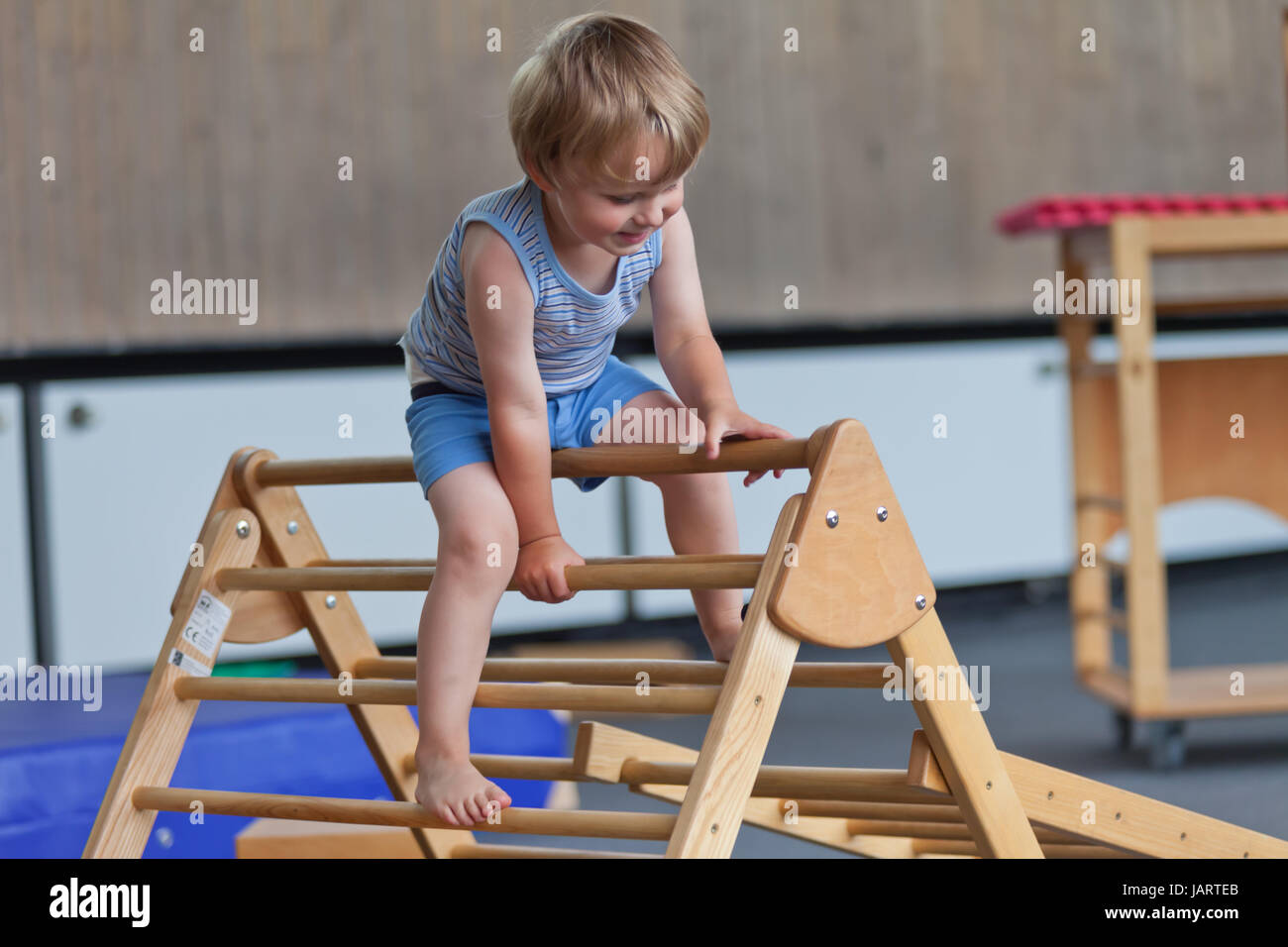 Boy climbing ladder in Gym Stock Photo Alamy