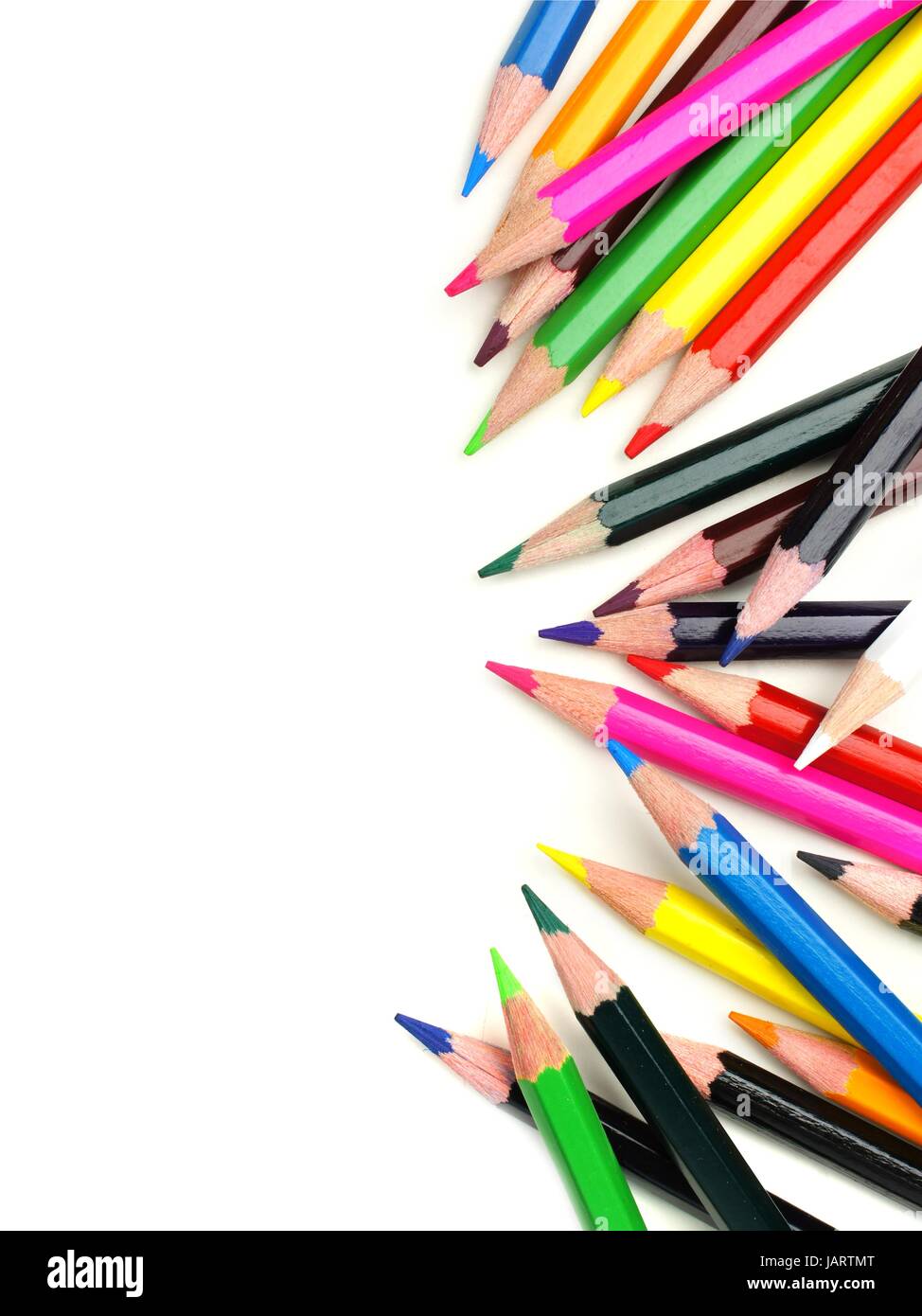 Colorful scattered pencil crayon border over a white background Stock Photo