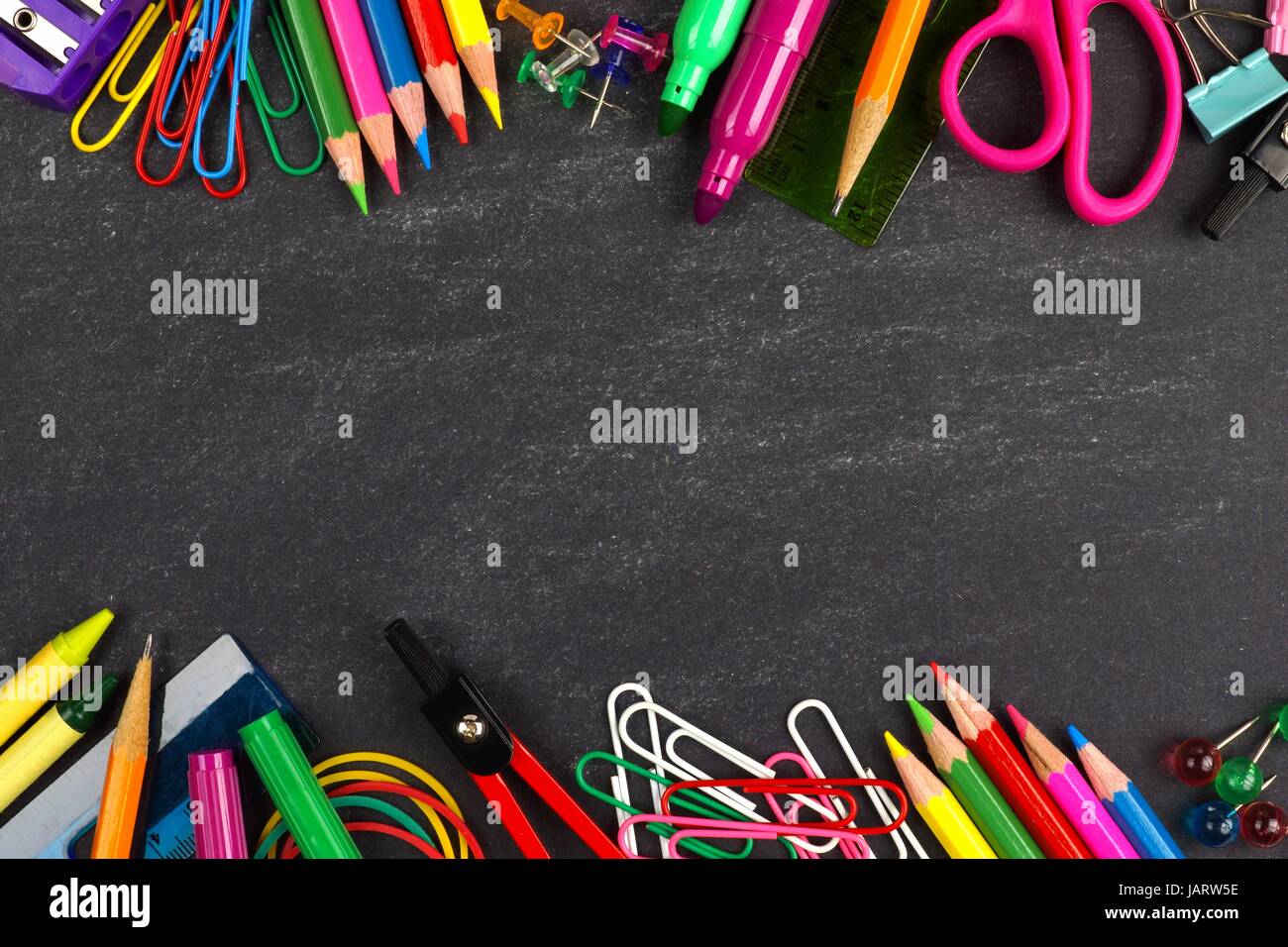 School supplies double border on a chalkboard background Stock Photo