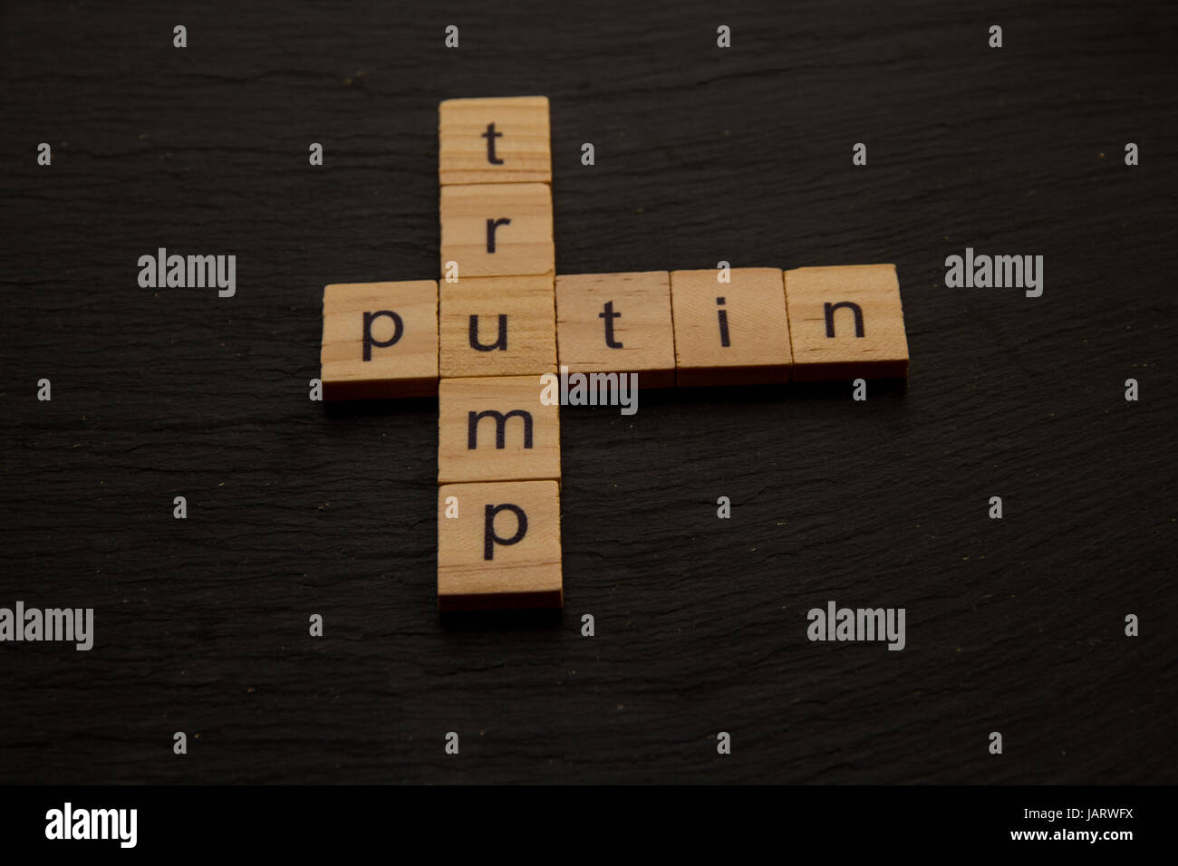 Toy letter blocks showing Trump and Putin like a crossword Stock Photo