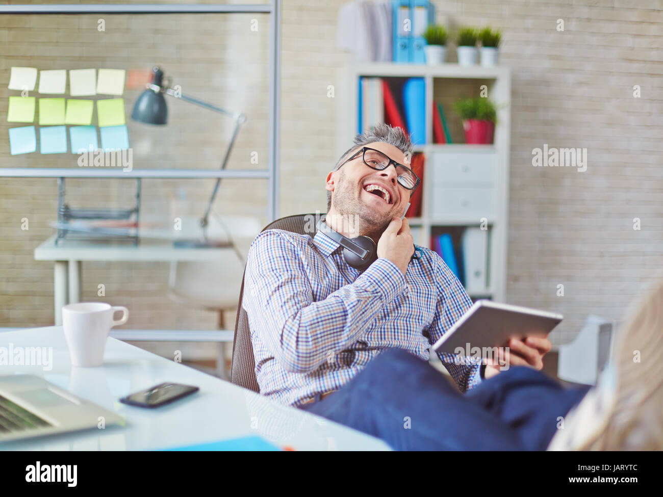 Laughing businessman on phone Stock Photo