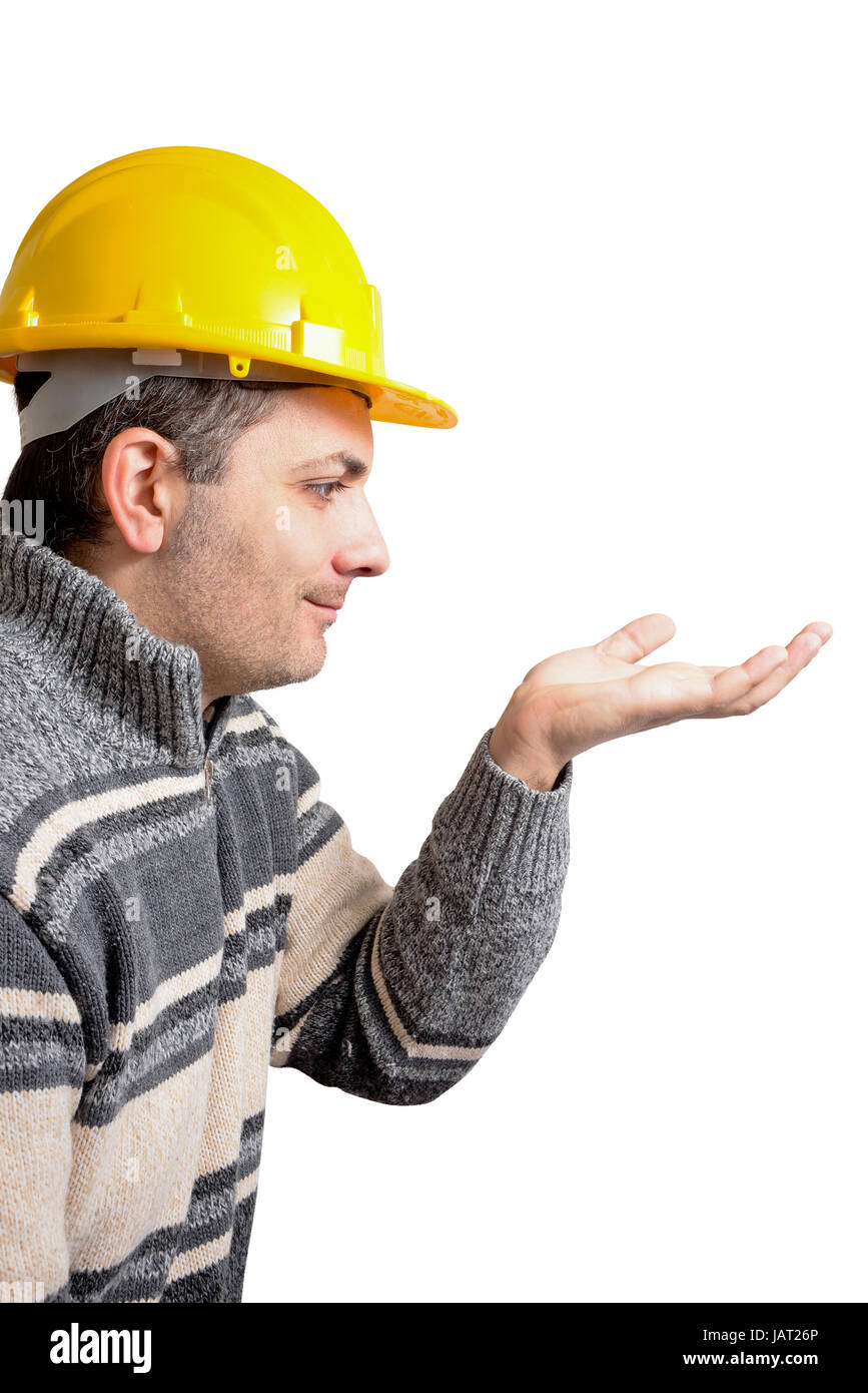 engineer with a helmet on his head, looking a building project that grows on his hand Stock Photo