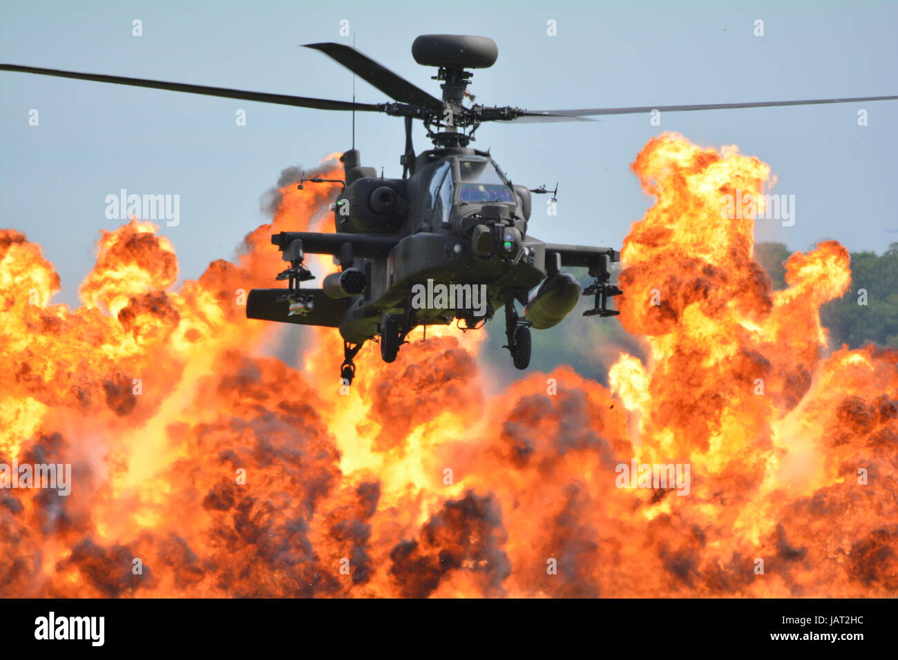 Apache  Attack helicopter with pyrotechnic explosion fire ball background Stock Photo