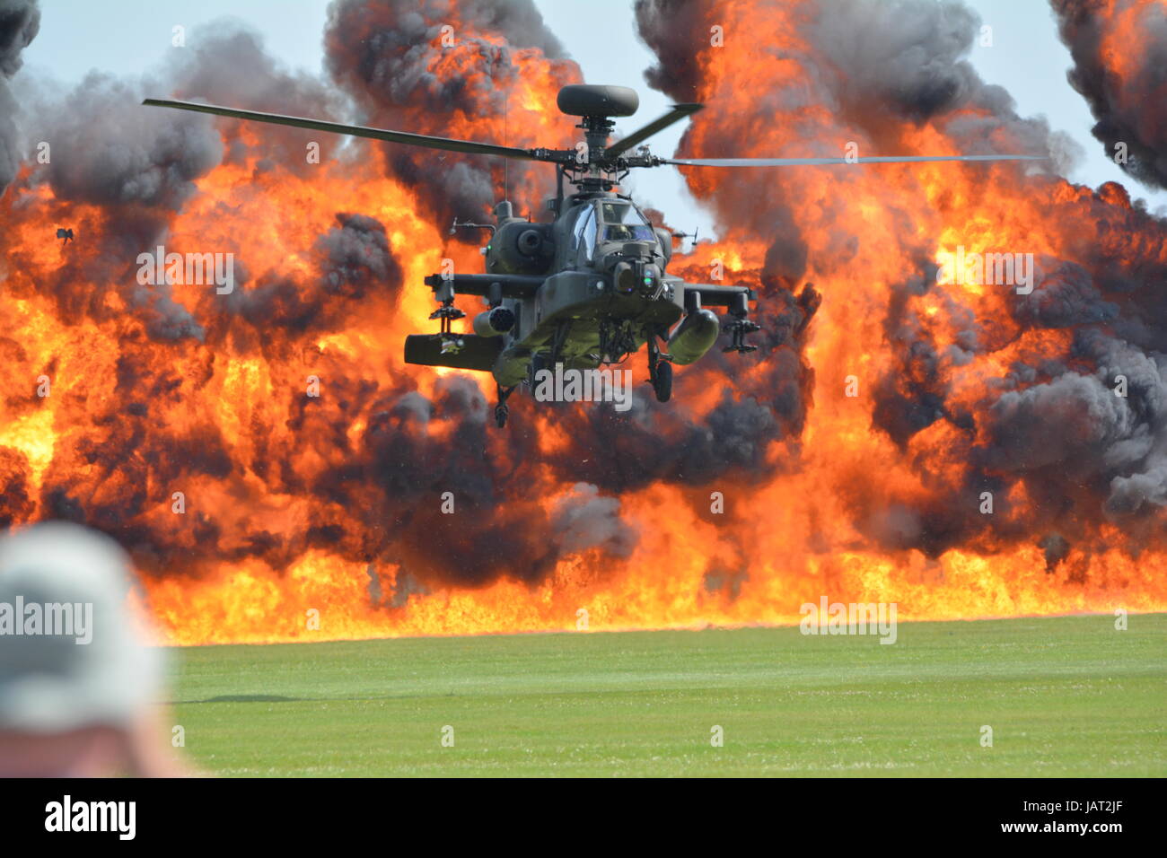 Apache Attack helicopter with pyro technic explosion fire ball ...