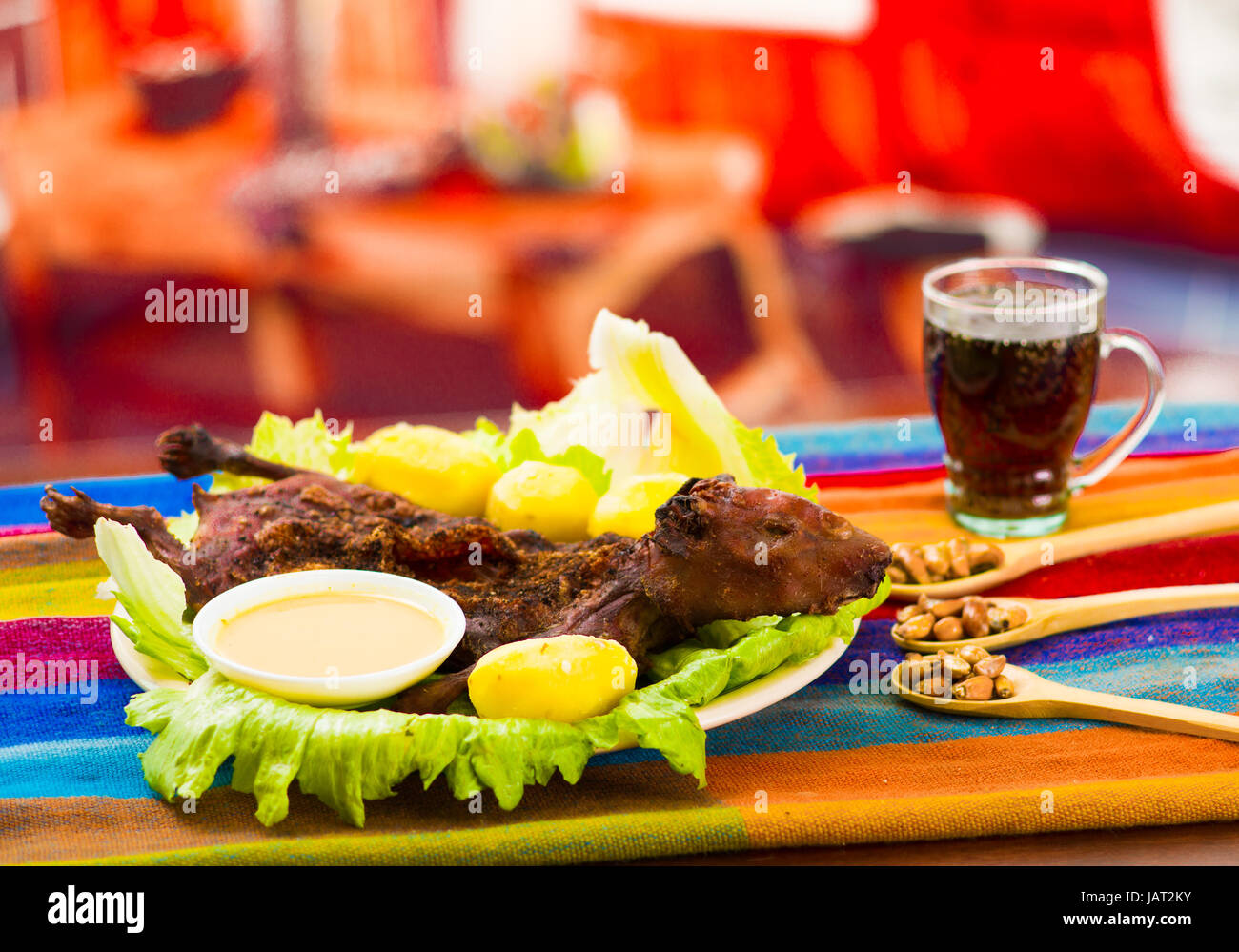 Photo inspiration: Traditional Ecuadorian Dish Grilled Guinea Pig Spread Out Onto Green Photo Inspiration