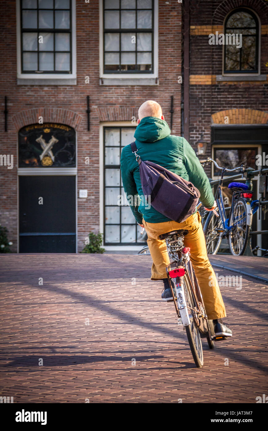 Cyclist on the streets of Amsterdam Stock Photo