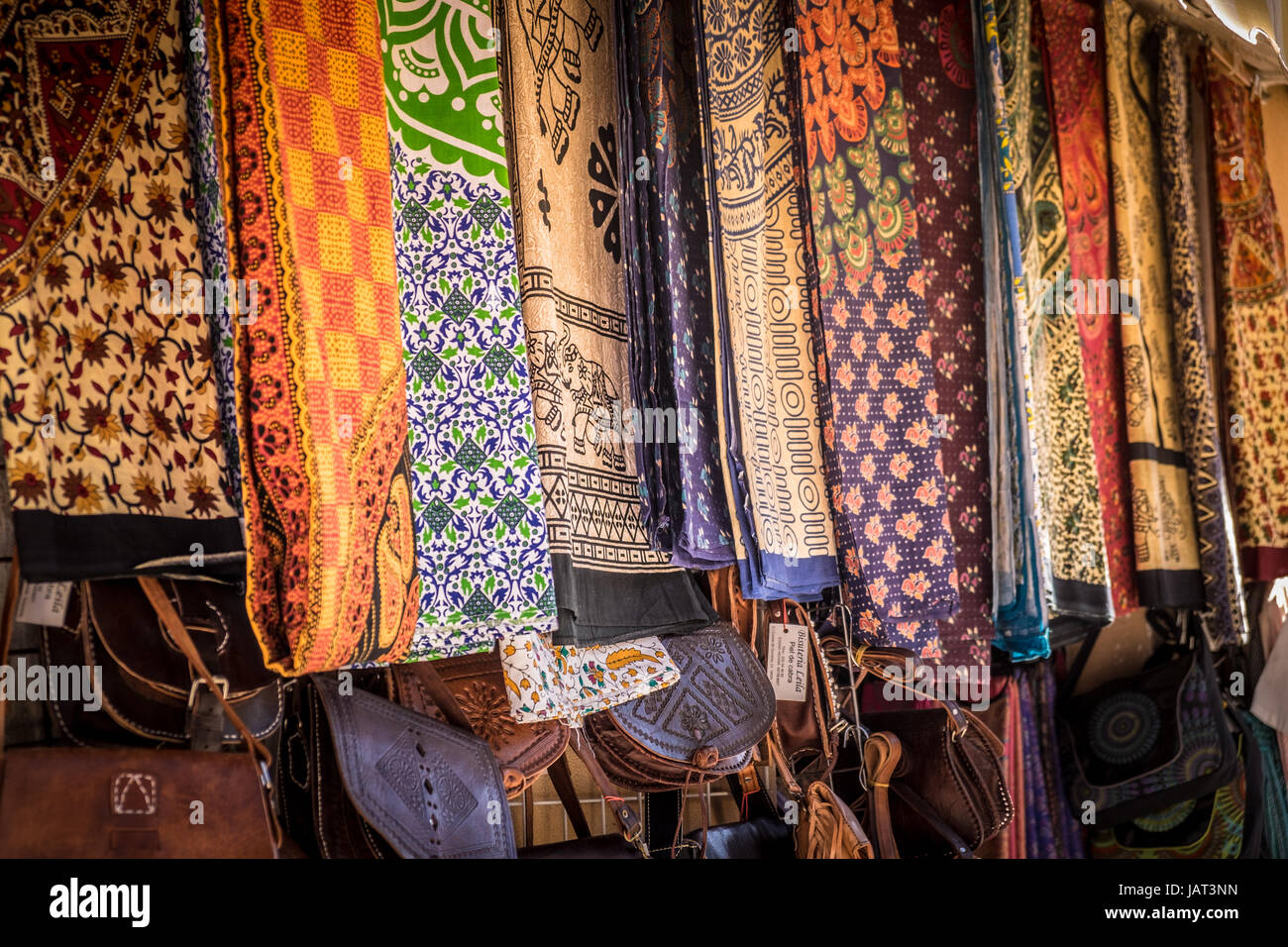 Fabrics & leather bags on display in a street market, Granada, Spain Stock Photo