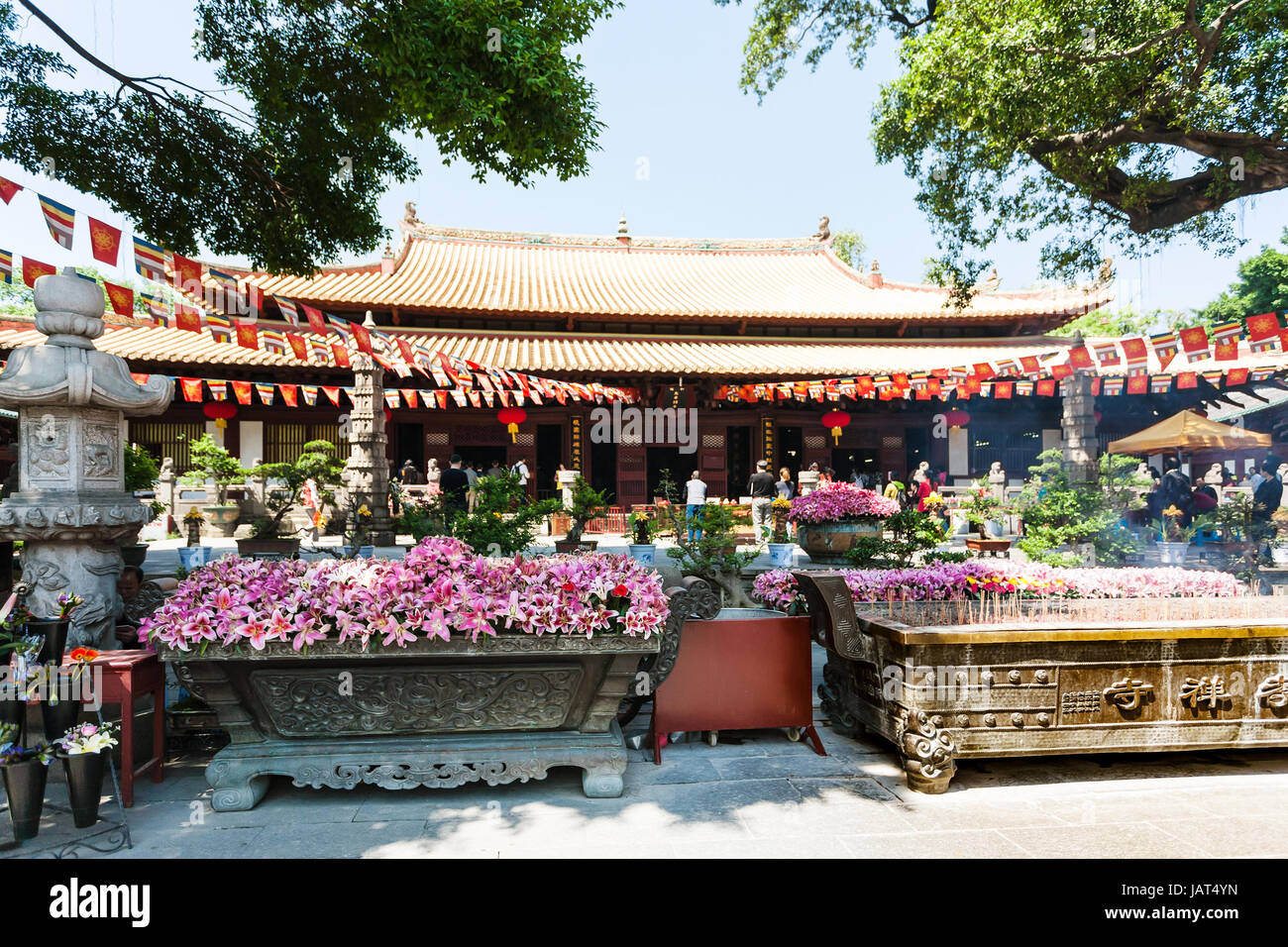 GUANGZHOU, CHINA - APRIL 1, 2017: people in court of Guangxiao Temple (Bright Obedience, Bright Filial Piety Temple). This is is one of the oldest Bud Stock Photo