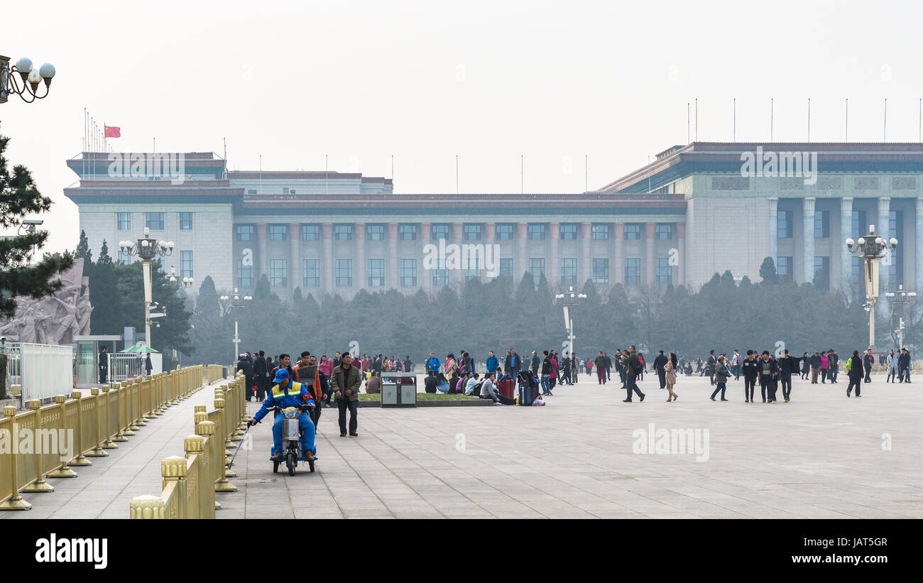 BEIJING, CHINA - MARCH 19, 2017: tourists and view of Great hall of The people on Tiananmen Square in spring. Tiananmen Square is central city square  Stock Photo