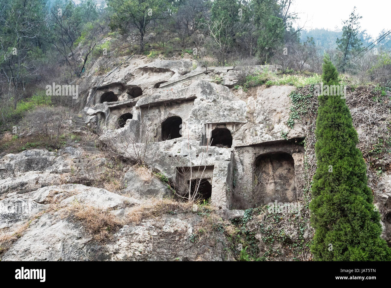 LUOYANG, CHINA - MARCH 20, 2017: caves in West Hill of Chinese Buddhist monument Longmen Grottoes. The complex was inscribed upon the UNESCO World Her Stock Photo