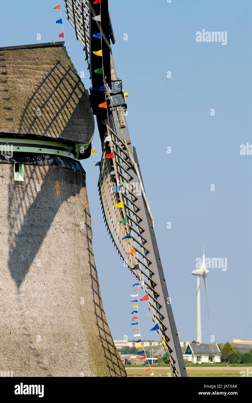 Netherlands,HOLLAND, old and new Windmill / Niederlande Holland Windmuehle und Windkraftanlage Stock Photo