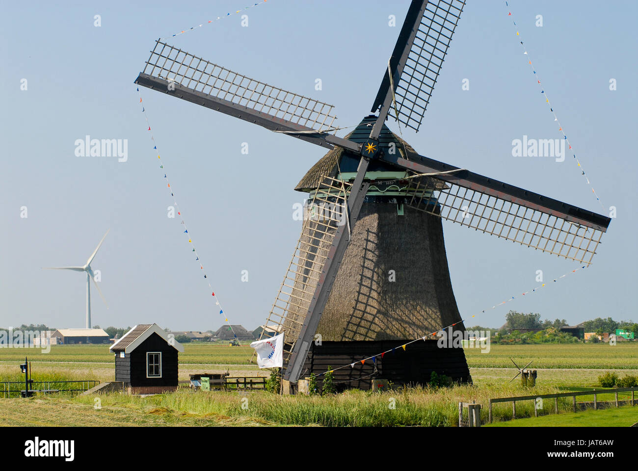 Netherlands,HOLLAND, old and new Windmill / Niederlande Holland Windmuehle und Windkraftanlage Stock Photo