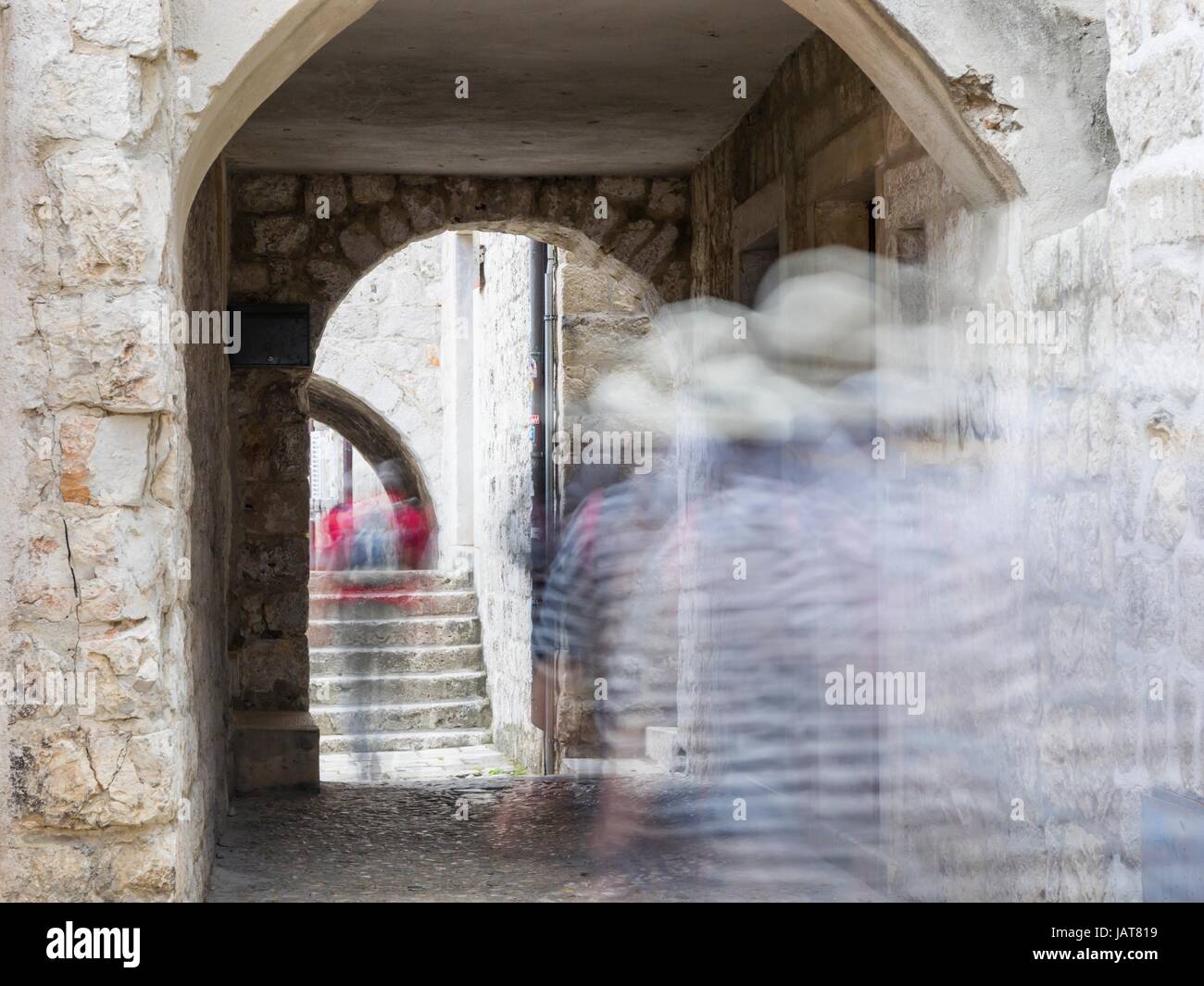 Dubrovnik in Croatia blurry people passing by ghosts ghost ghosted image Stock Photo