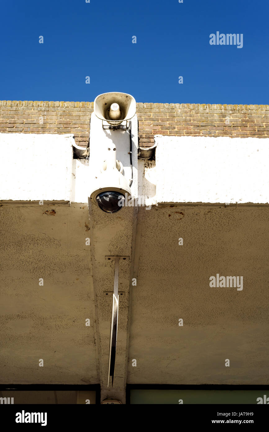 Single security CCTV camera and a public address speaker system on a ...