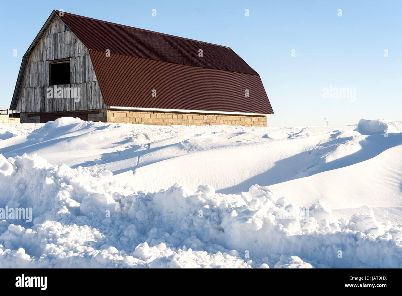 Old derelict and deserted barn covered in snow in daylight Stock Photo ...