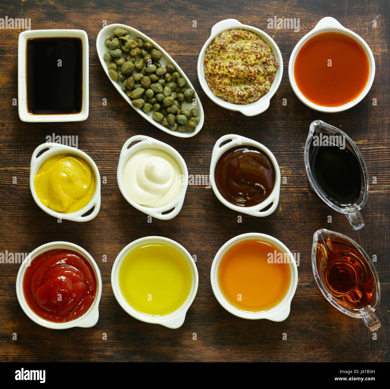 Different types of sauces and oils in bowls, top view Stock Photo Alamy