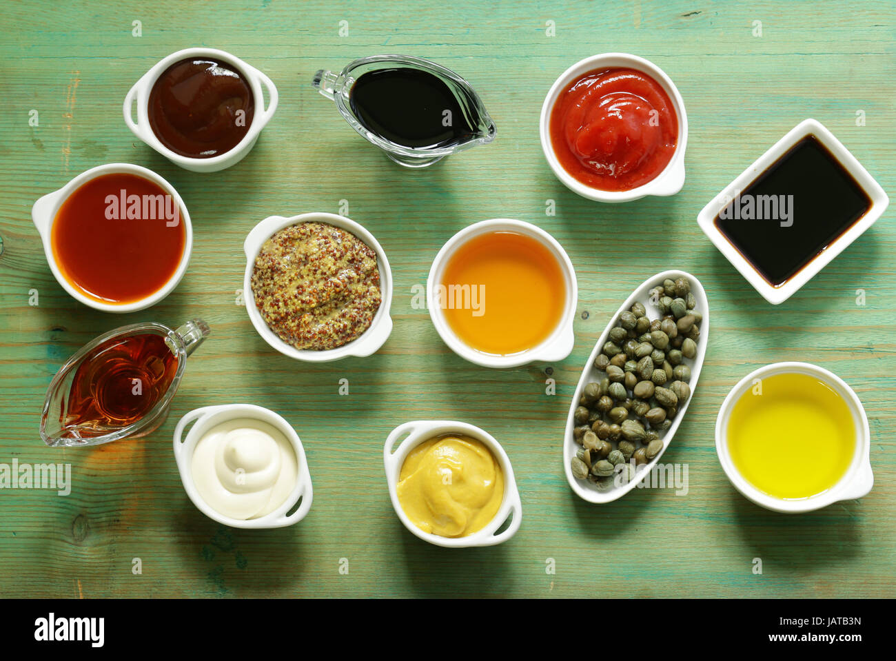 Different types of sauces and oils in bowls, top view Stock Photo Alamy