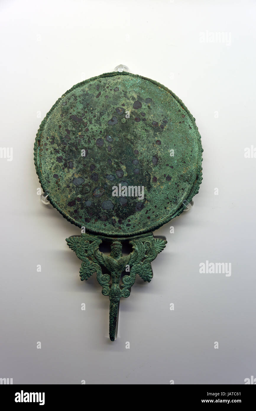 Bronze mirror with a Siren between the mirror and the handle tang. Italy, c. 480 BC.British Museum. London, UK Stock Photo