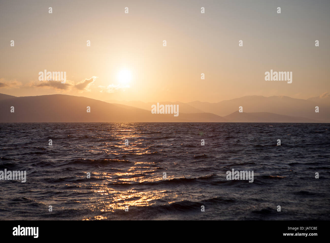 Abstract sunrise over ocean sun hi-res stock photography and images - Alamy